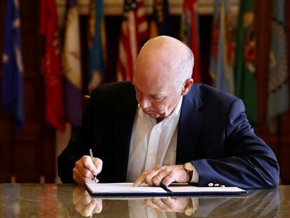 Republican Gov. Greg Gianforte signs a law banning TikTok in the state, May 17, 2023, in Helena, Mont.