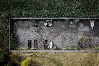 Aerial view of boats in a dry lake harbor in Velence, Hungary; August 2022.