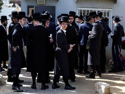 A group of ultra-Orthodox Israelis waiting to process their draft exemptions at the Kiryat Ono recruitment base last Thursday.