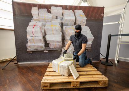 A customs officer in Munich, Germany, displays a package from what was the largest cocaine seizure in the Bavarian region, in July 2022.