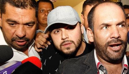 Singer Gerardo Ortiz (c) after making a statement.