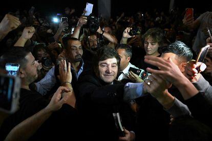 Javier Milei greets his supporters during the launch of his book, 'The End of Inflation.' 
