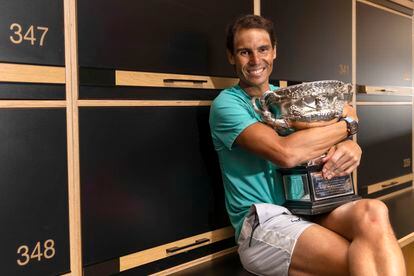 Rafa Nadal embraces the Australian Open trophy.