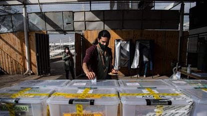 A man casts his vote during local elections in Chile, March 2021.