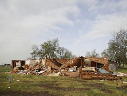 A home sits in rubble on Thursday, April 20, 2023, after a storm hit Shawnee Okla., on Wednesday