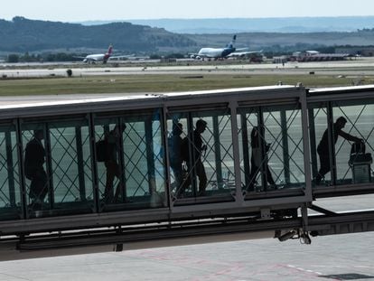Passengers arriving at Adolfo Suárez Madrid-Barajas airport.