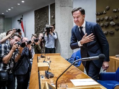 Outgoing Dutch Prime Minister Mark Rutte greets the press in the House of Representatives in The Hague, the Netherlands, on Monday.