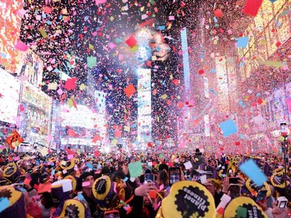 Confetti flies around Times Square as people welcome the New Year, on January 1, 2023.
