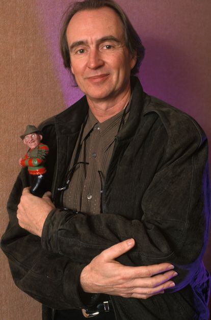 Wes Craven with a Freddy Krueger doll.