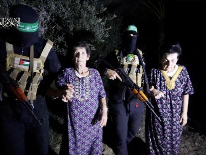 Two women who were held hostages by Palestinian Hamas militants, are released in this video screengrab obtained by Reuters on October 23, 2023.