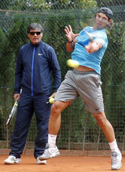 Nadal training with his coach and uncle, Toni.