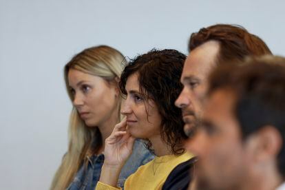 Nadal's wife, Xisca Perelló, between the player's sister and his coach, Carlos Moyá, during Thursday's press conference.
