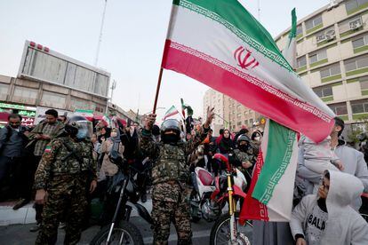 Iran supporters celebrate their victory over Wales in the streets of Tehran.