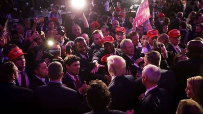 Donald Trump greets supporters following his election win.