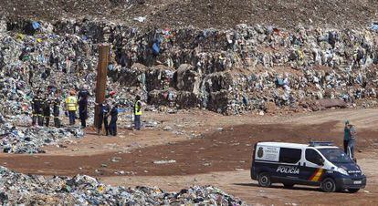Police agents searching for the missing child at the Dos Aguas garbage dump.