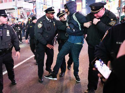 A demonstrator is detained by police during an arrest in New York City, on Friday, January 27, 2023.