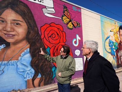 Artist Abel Ortiz gives Attorney General Merrick Garland a tour of murals of the Uvalde shooting victims, in Uvalde, Texas, U.S., January 17, 2024.