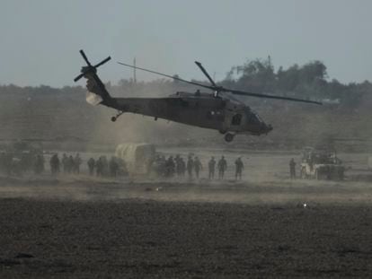 Israeli military helicopter lands near the Gaza Strip border on Saturday, Dec. 9, 2023