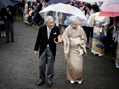 In this Nov. 9, 2018, file photo, Japan's Emperor Akihito, left, and Empress Michiko, right, greet the guests during the autumn garden party at the Akasaka Palace imperial garden in Tokyo.