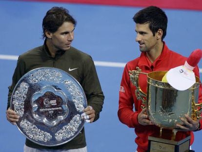 Spain&#039;s Rafael Nadal (l) and Novak Djokovic of Serbia pose with their trophies after their men&#039;s singles final match at the China Open.