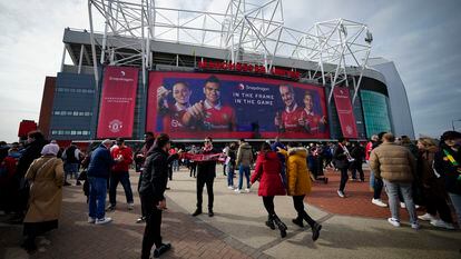 Fans outside the Old Trafford stadium in Manchester ahead the English Premier League soccer match between Manchester United and Southampton, England, Sunday, March 12, 2023.