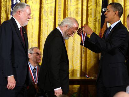 Then-President Barack Obama presents John E. Warnock (center) and Charles M. Geschke (left) with the National Medal of Science in 2009.