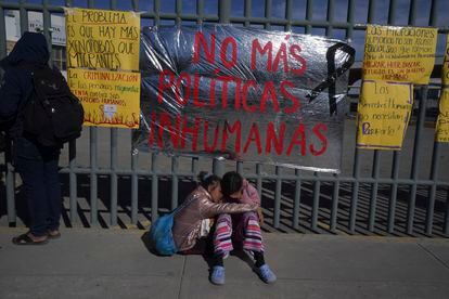 Two young Venezuelan women embrace outside the detention center in Ciudad Juárez.