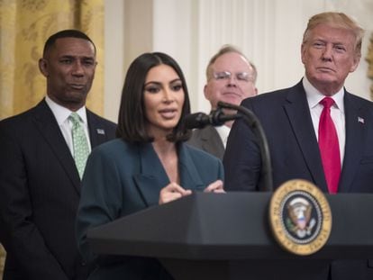 Donald Trump listens to Kim Kardashian's speech at the White House on June 13, 2019.