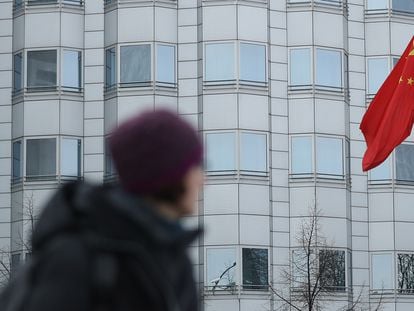 A woman walks in front of the Chinese Embassy in Berlin in December 2017, when Germany accused China of espionage and trying to recruit agents.