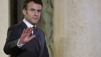 France's President Emmanuel Macron gestures as he waits for Hungarian Prime Minister before a working dinner at the Elysee Presidential Palace in Paris on March 13, 2023.