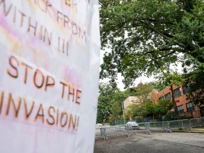 Protest signs are posted outside the former Saint John Villa Academy being repurposed as a shelter for homeless migrants, Wednesday, Sept. 13, 2023, in the Staten Island borough of New York.
