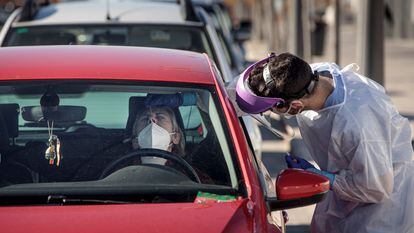A woman undergoing a Covid-19 test outside La Fe Hospital in Valencia, Spain.