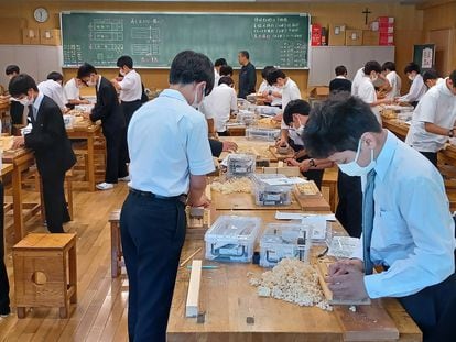 Students at the Seiko Gakuin High School in Yokohama, Japan, during a crafts class where they learn how to make wooden chopsticks.