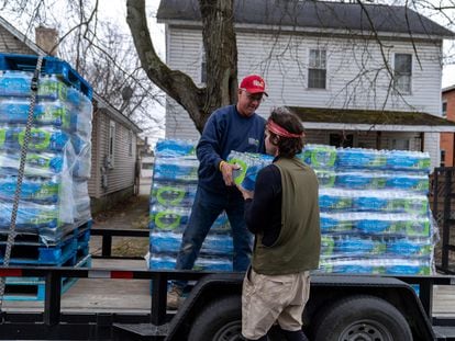 Michael Young passes out water to residents on February 16, 2023 in East Palestine, Ohio. On February 3rd, a Norfolk Southern Railways train carrying toxic chemicals derailed causing an environmental disaster.
