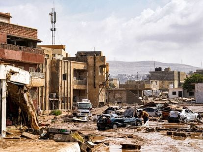 A view of destroyed vehicles and damaged buildings in the eastern city of Benghazi in the wake of the Mediterranean storm Daniel.