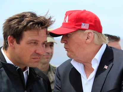 Former president Donald Trump talks to Florida Governor Ron DeSantis during a visit to Lake Okeechobee and Herbert Hoover Dike at Canal Point, Florida, in March 2019.