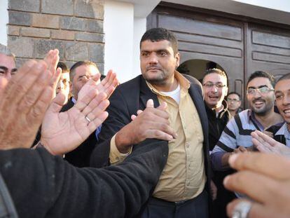 Said Chramti, &quot;The Giant,&quot; is greeted by followers on leaving the police station in Nador last month.