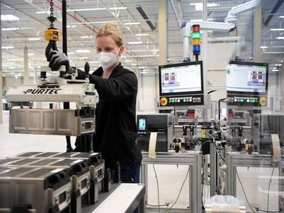 An employee at Microvast, a battery factory in the US, tests lithium-ion units.