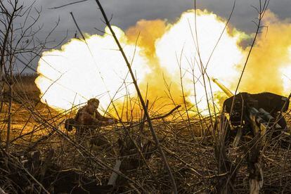 A Ukrainian artilleryman fires towards Russian positions on the outskirts of Bakhmut, eastern Ukraine on December 30, 2022.