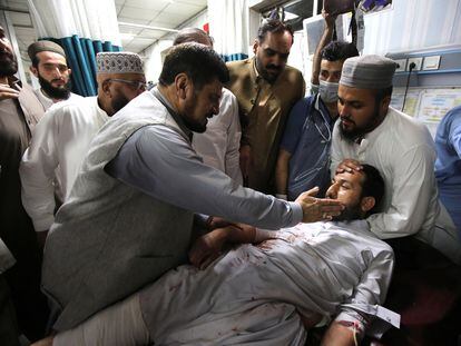 Governor of KPK province Haji Ghulam Ali visitis a victim of a blast targeting a gathering of Islamic political party Jamiat Ulma-e-Islam (JUI-F), at a hospital in Peshawar, Pakistan, on July 30, 2023.