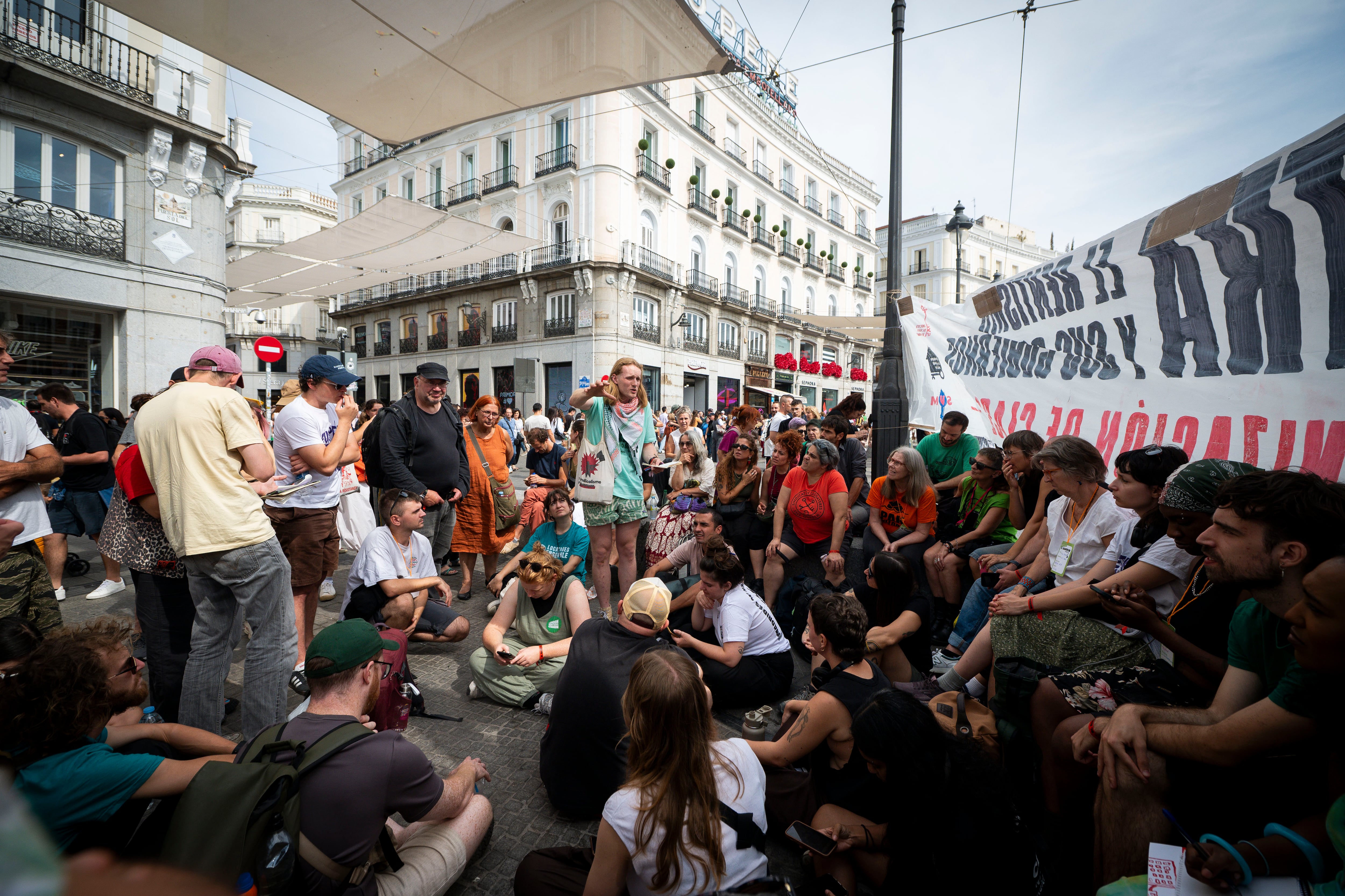 Members from different countries of the European Action Coalition for the Right to Housing and the City hold an assembly at Puerta del Sol.