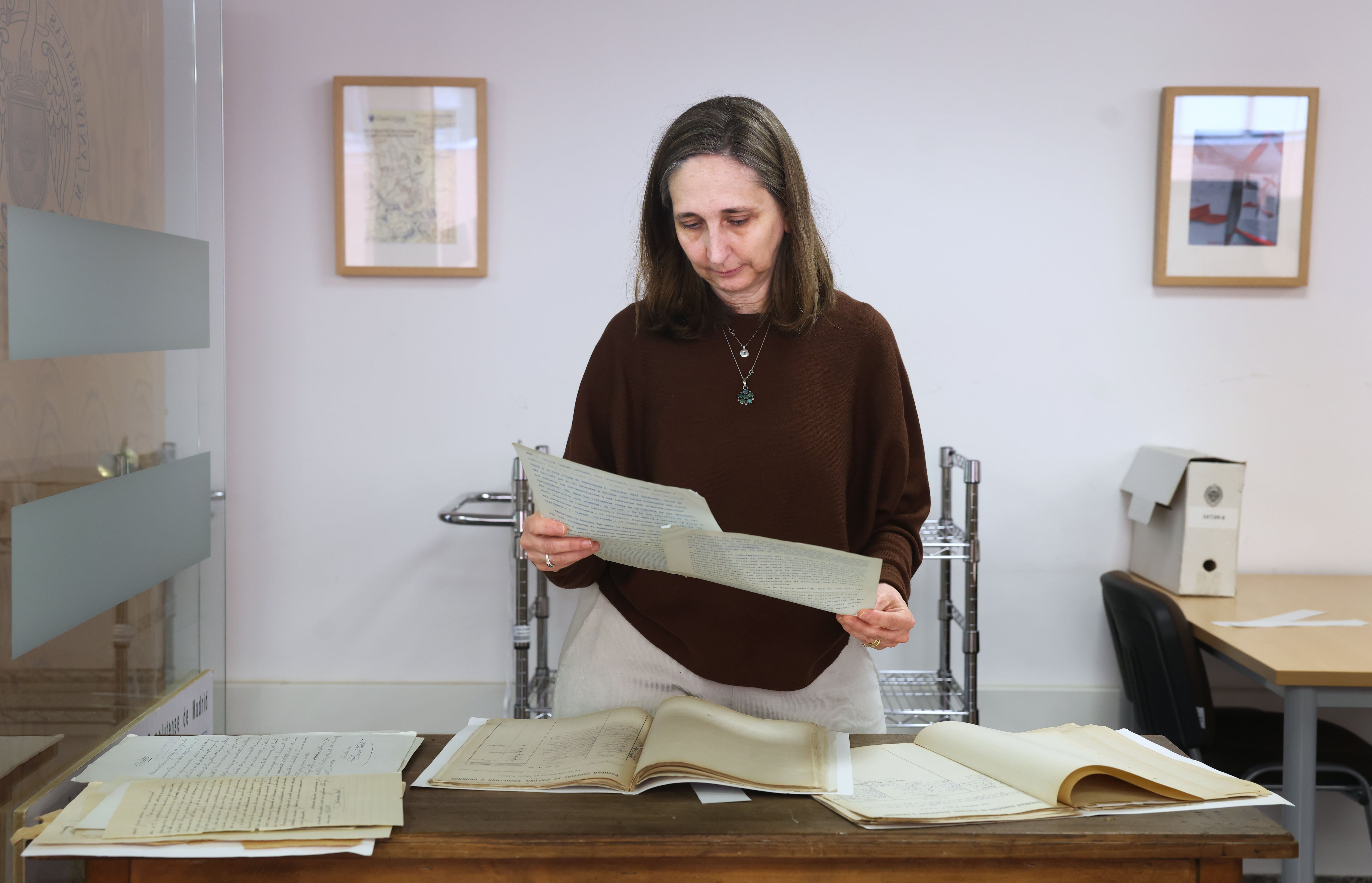 Ana Rocasolano, director of the Complutense University’s general archive holds up several of the Dalí documents in the law department.