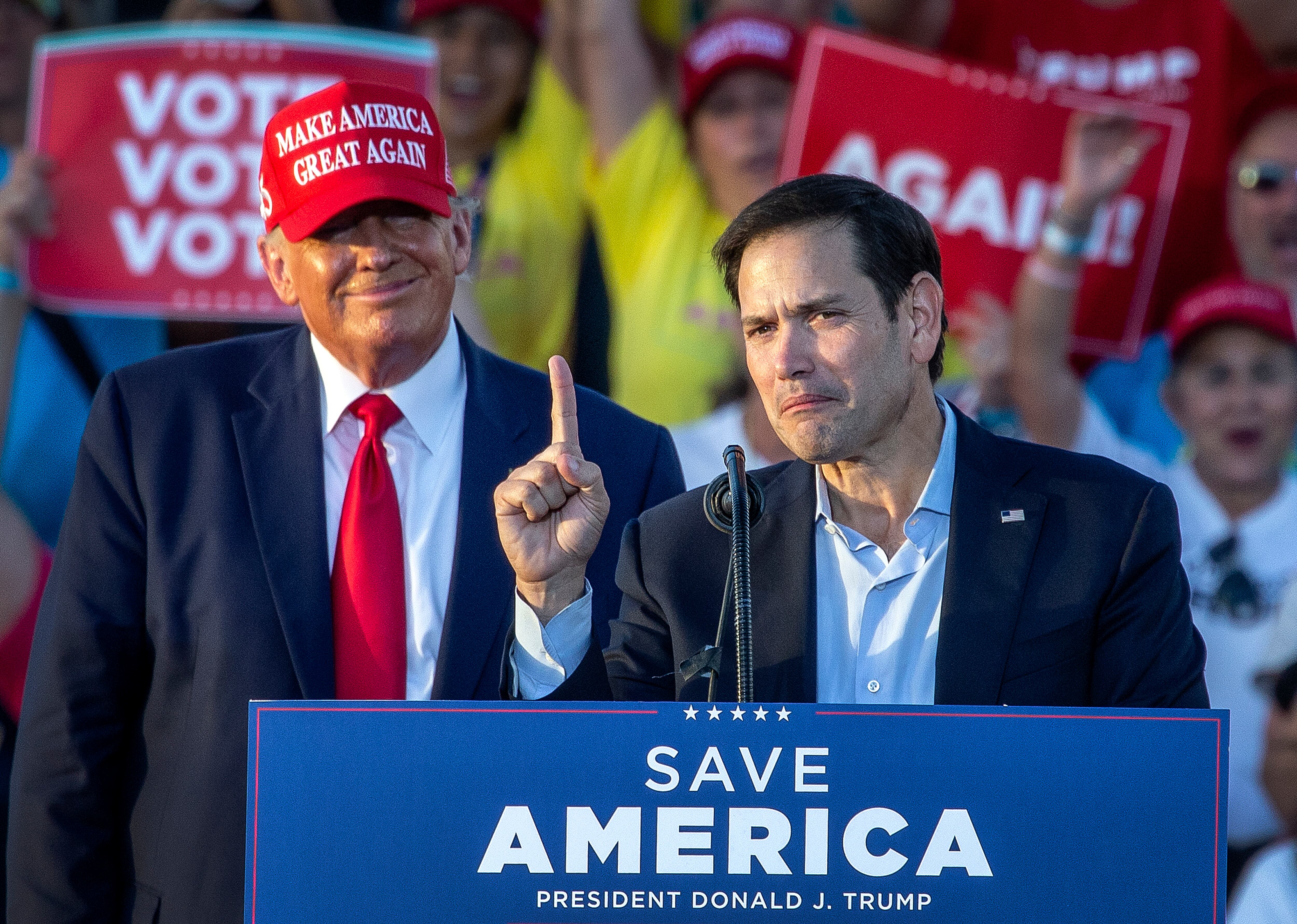 Marco Rubio speaks at a rally in Miami in 2022, as Trump looks on.