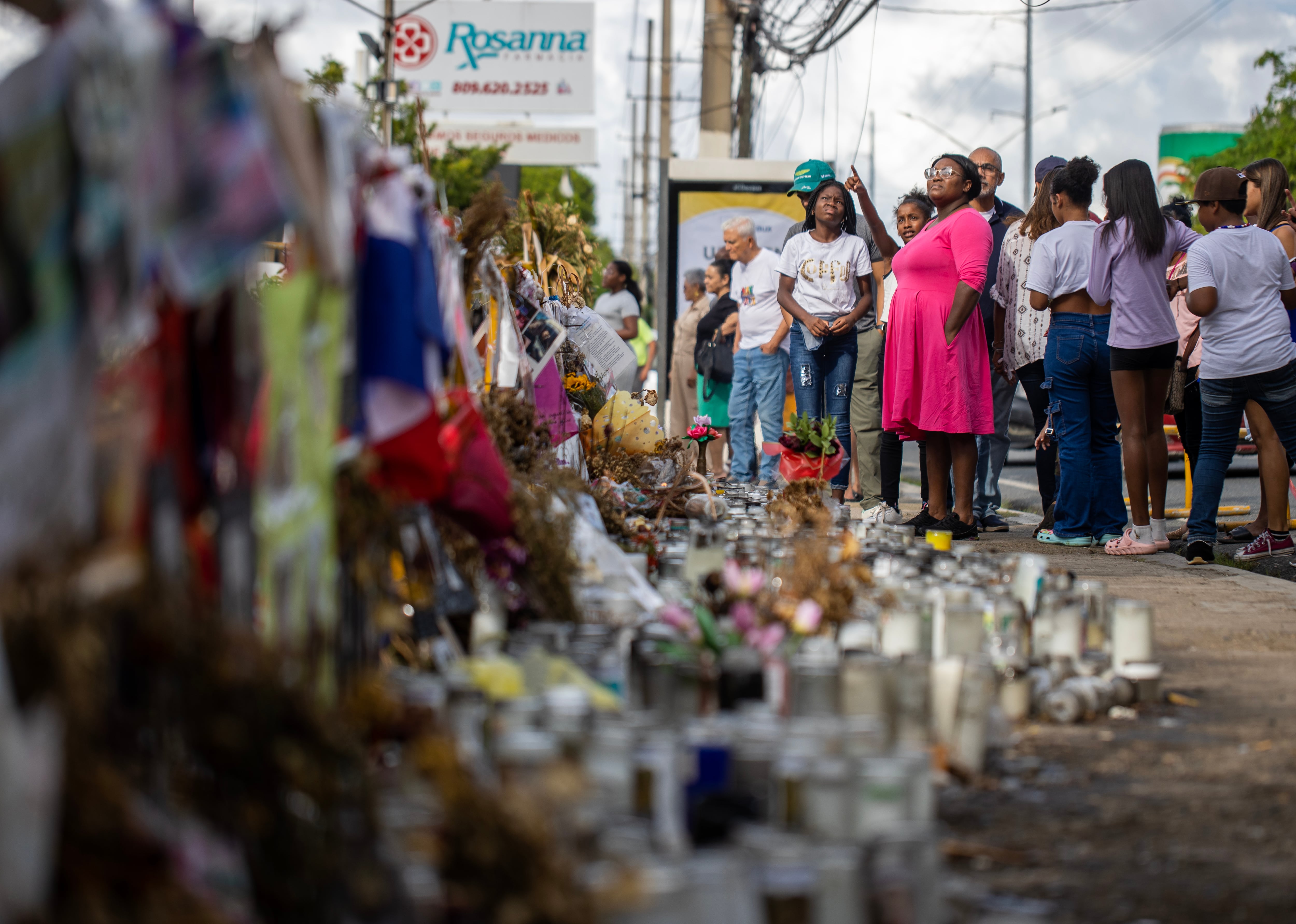 Drawings, photographs, candles, and flowers placed by citizens in front of the premises where the Jet Set nightclub used to operate.