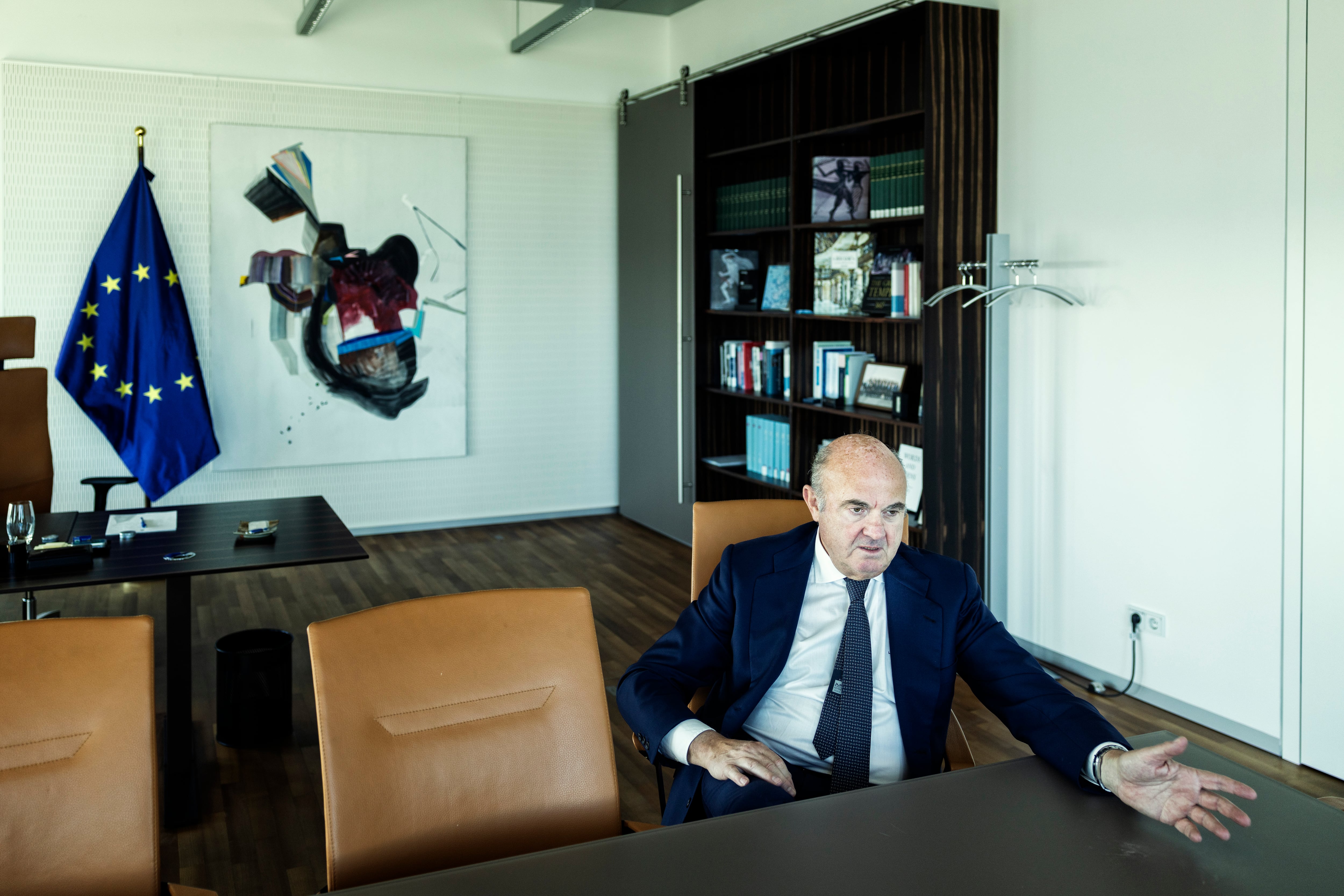 Luis de Guindos poses after the interview next to his chair in the ECB Governing Council meeting room.
