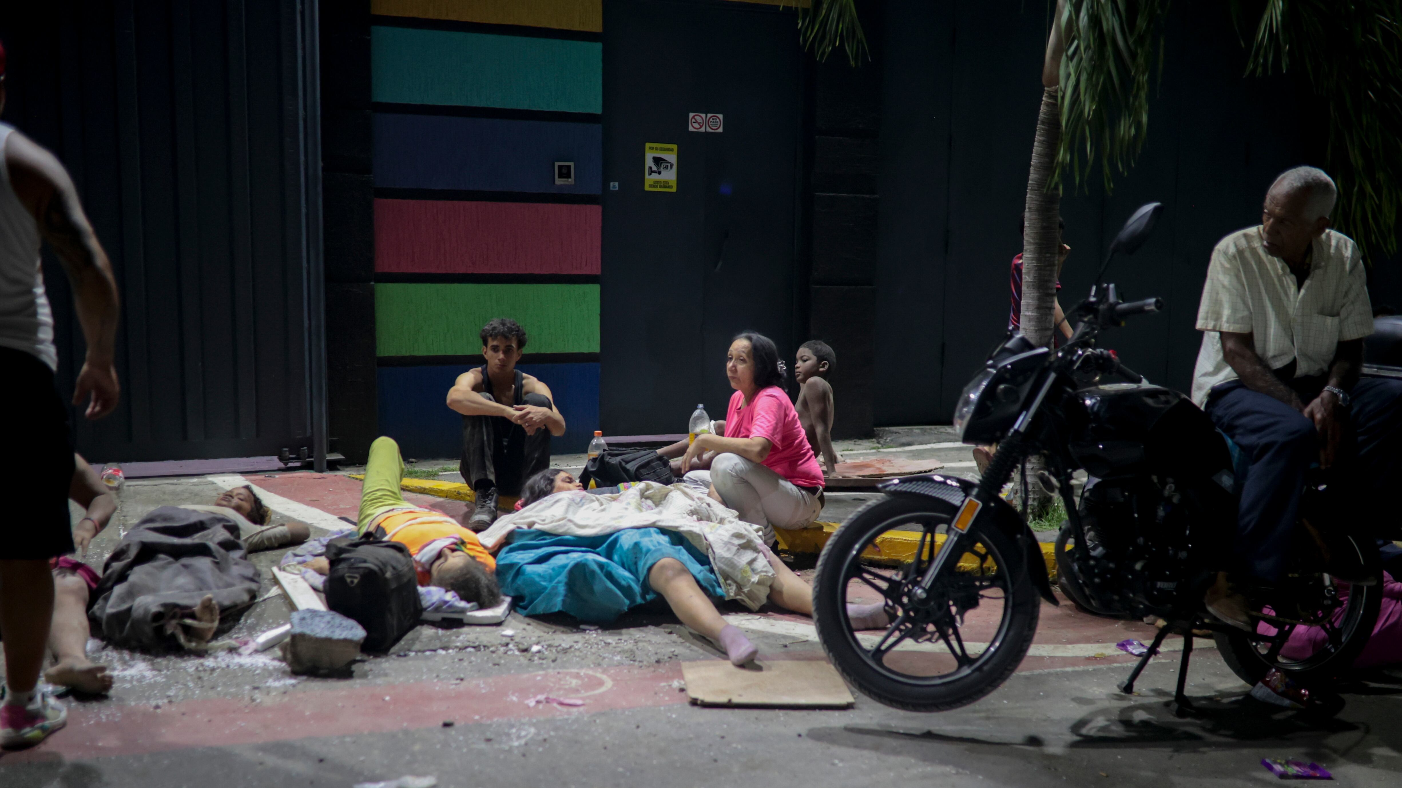 Aid trickles in, survivors sleep outside, and looting breaks out in La Guaira, the Venezuelan city hardest hit by the earthquake
