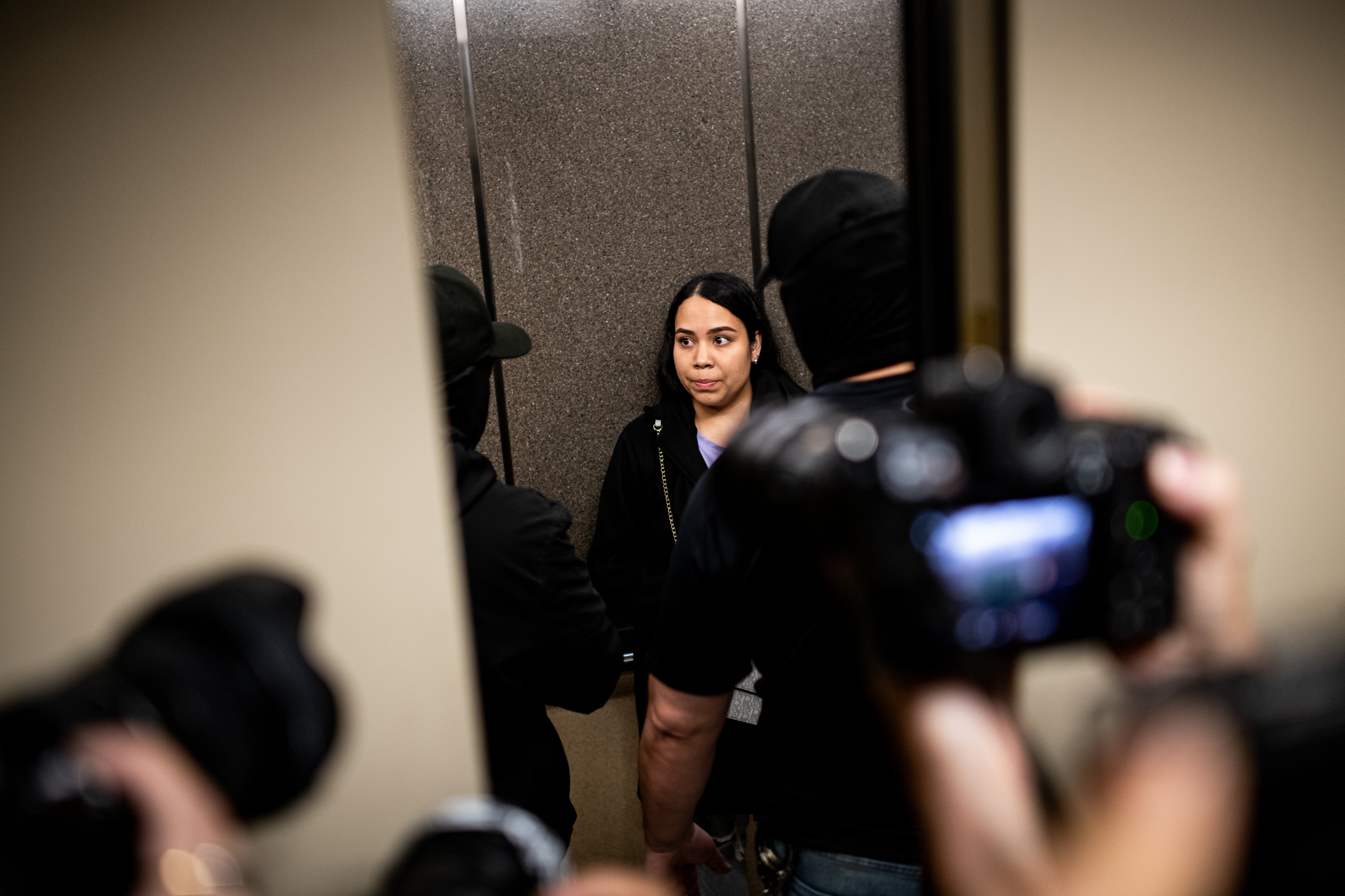 Detention of a woman by immigration agents, in New York.