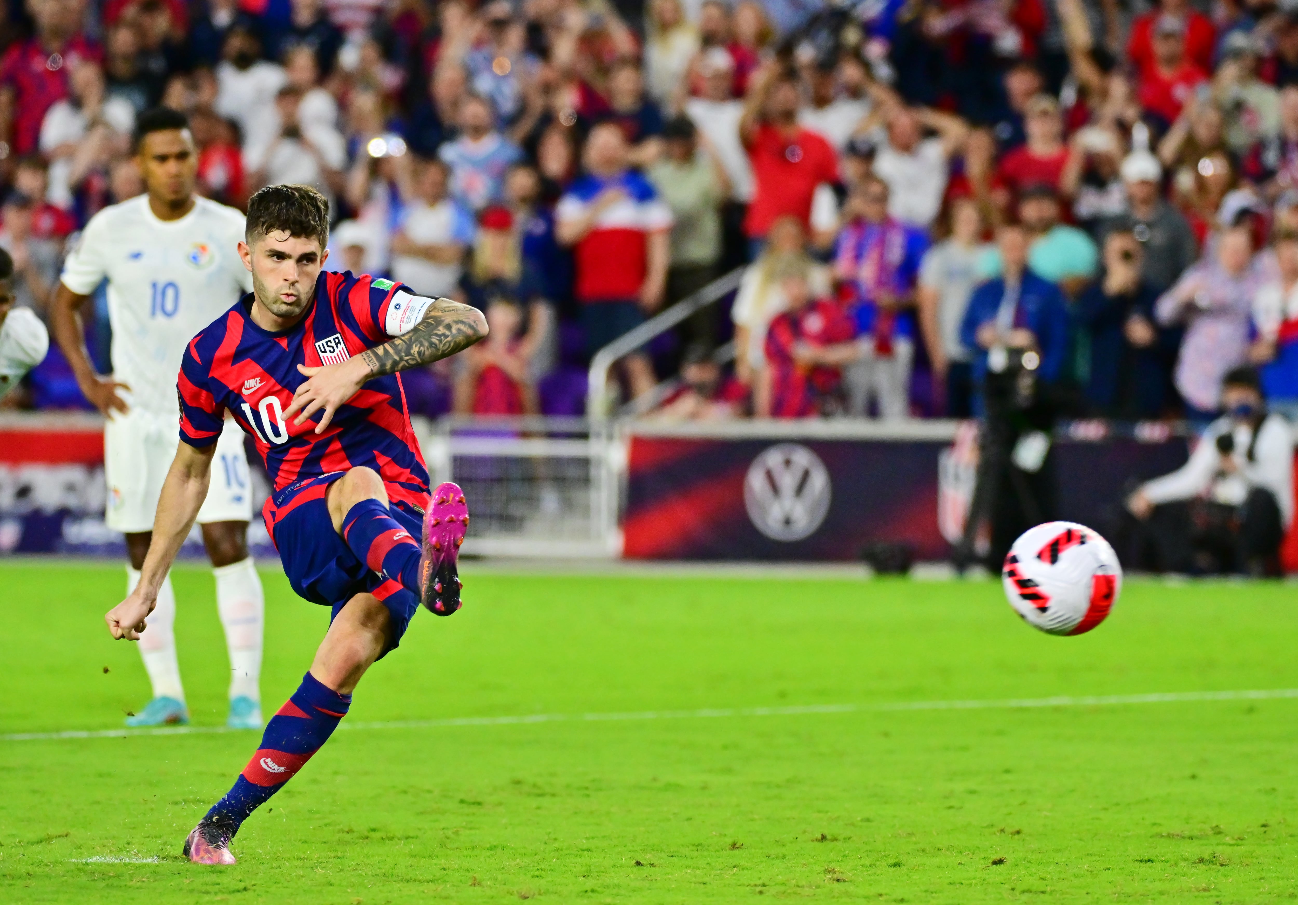 Christian Pulisic of the USA team takes a penalty kick against Panama in March 2022.