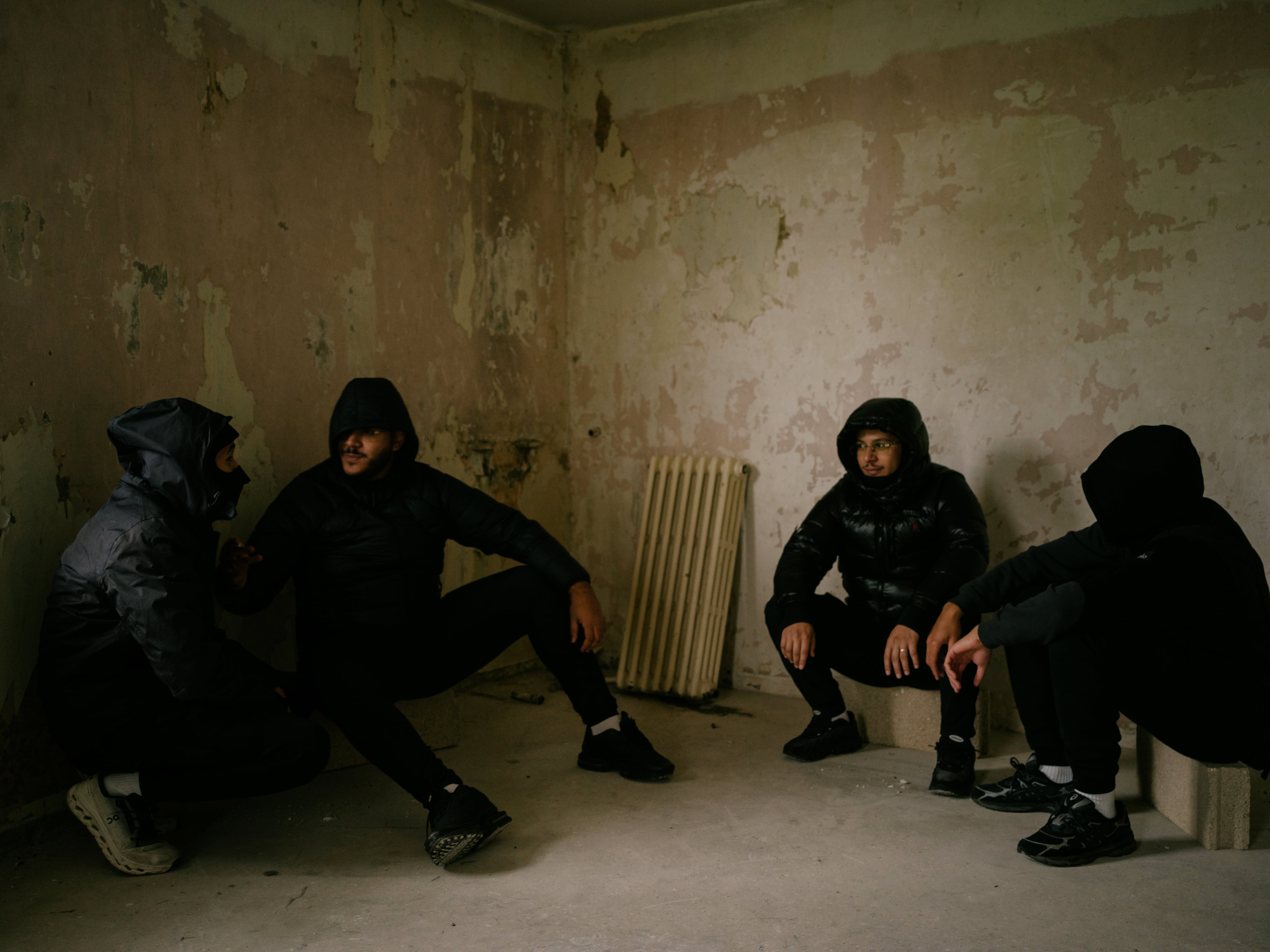 Moktar talks with his friends in an abandoned apartment in Bondy, a 'banlieue' north of Paris.