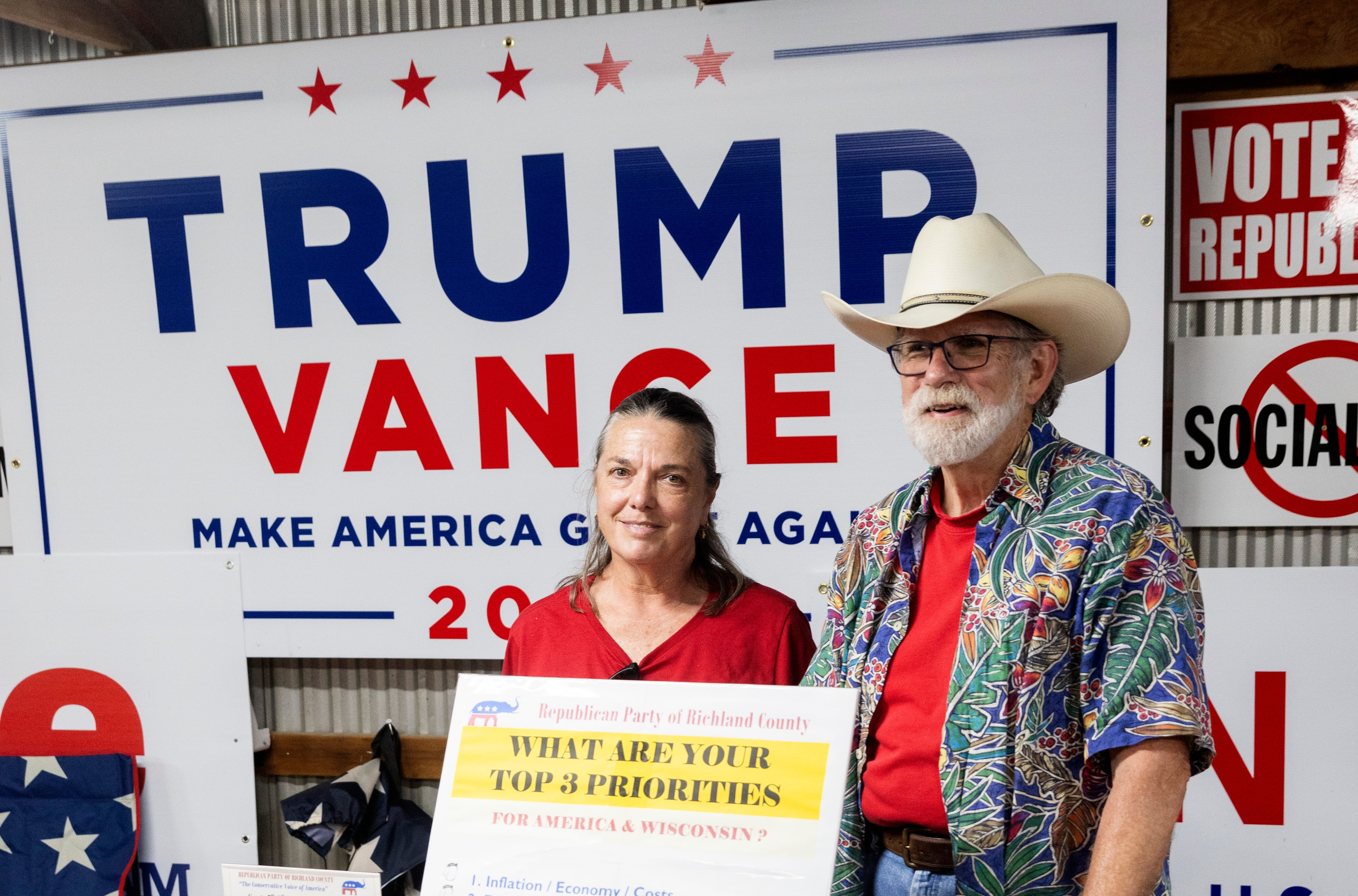 Ann Declene and Bruce Taylor staff the Republican Party table at the Richland County Fair in Richland, Wisconsin, on September 5.